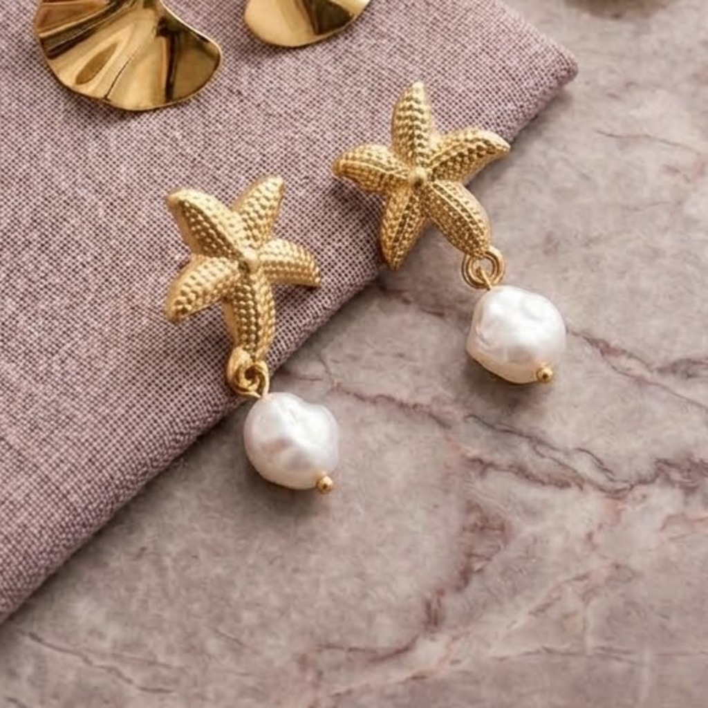 Aros de acero inoxidable en forma de estrella de mar con perla